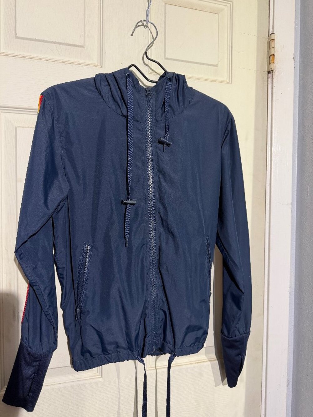 ZYIA Active Navy Rainbow Stripe Hooded Windbreaker Jacket